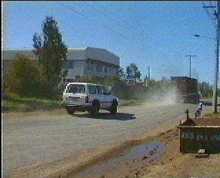 dust raised by passing vehicles.